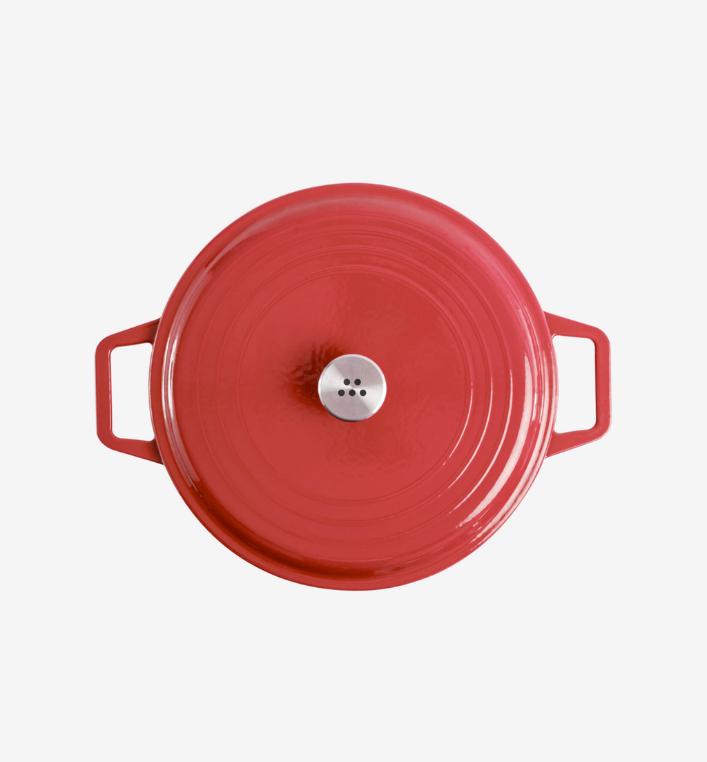 Red enameled cast iron Dutch oven with stainless steel lid knob, top view